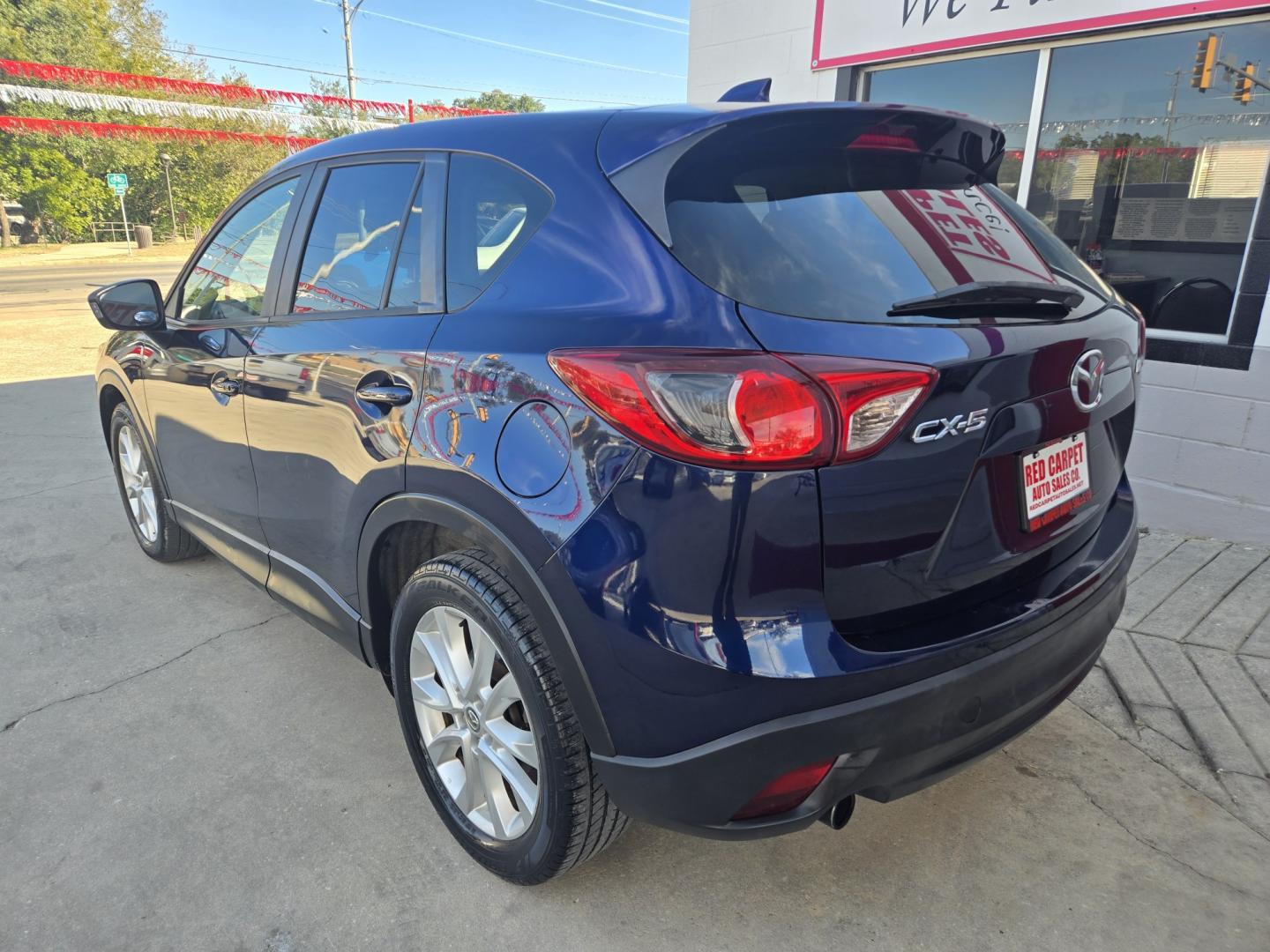 2013 BLUE Mazda CX-5 Grand Touring (JM3KE2DE8D0) with an 2.0L l4 F DOHC 16V engine, 6A transmission, located at 503 West Court, Seguin, TX, 78155, (830) 379-3373, 29.568621, -97.969803 - 2013 Mazda CX-5 Grand Touring with a 2.0L l4 F DOHC 16V, Automatic, Tilt, Cruise, AM/FM/CD Touchscreen Stereo, Power Windows, Locks, Seats and Side Mirrors, Leather Seating, Bluetooth, Dual Climate Control, Power Sunroof, Tinted Windows, Alloy Wheels, Rear Wiper, Rear Defroster and more!!- Photo#3