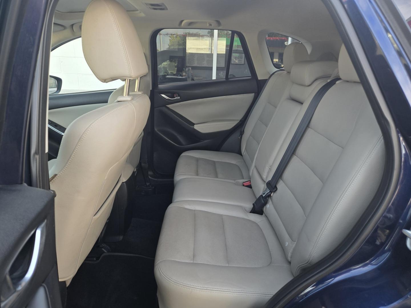 2013 BLUE Mazda CX-5 Grand Touring (JM3KE2DE8D0) with an 2.0L l4 F DOHC 16V engine, 6A transmission, located at 503 West Court, Seguin, TX, 78155, (830) 379-3373, 29.568621, -97.969803 - 2013 Mazda CX-5 Grand Touring with a 2.0L l4 F DOHC 16V, Automatic, Tilt, Cruise, AM/FM/CD Touchscreen Stereo, Power Windows, Locks, Seats and Side Mirrors, Leather Seating, Bluetooth, Dual Climate Control, Power Sunroof, Tinted Windows, Alloy Wheels, Rear Wiper, Rear Defroster and more!!- Photo#6